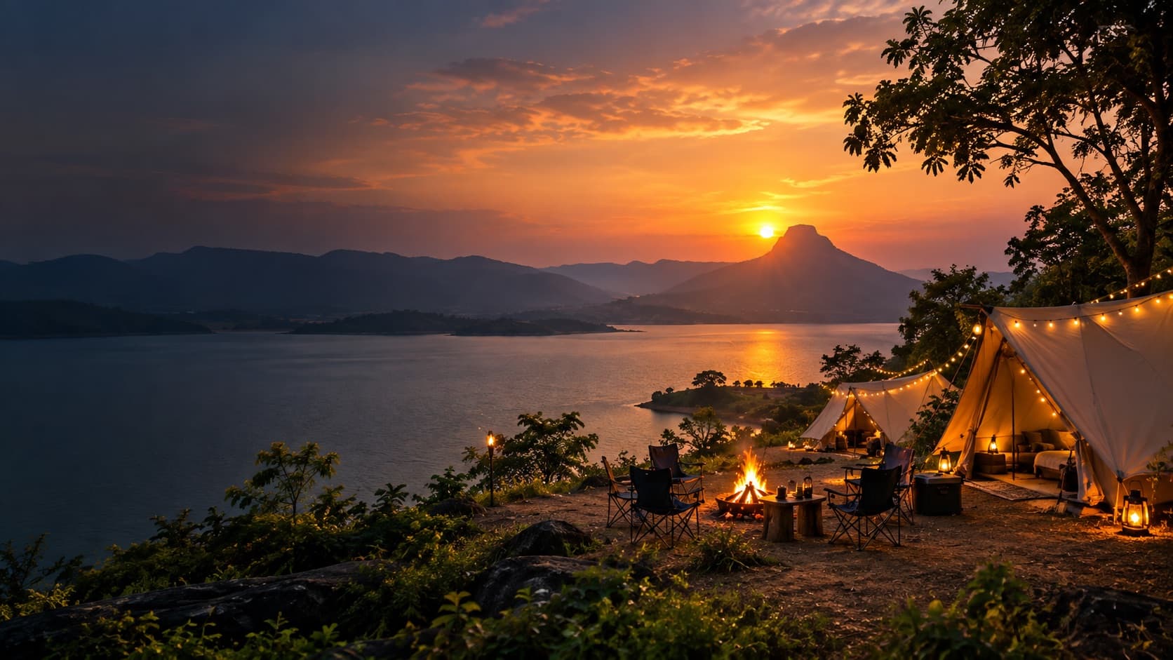 Luxury glamping tents overlooking a Maharashtra lake at sunset